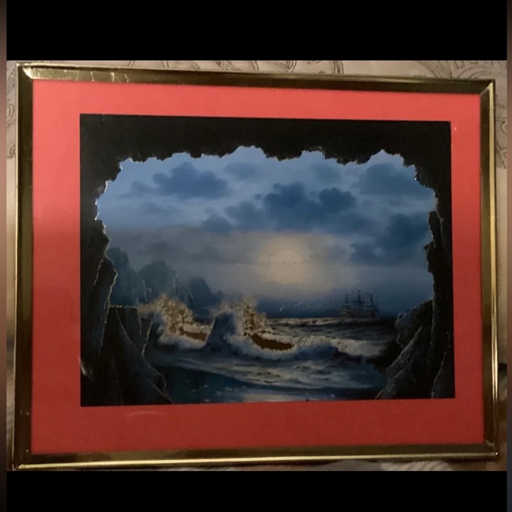 A reflective foil art rendition of the Pirate’s Cove oil painting